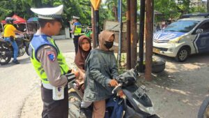 Satlantas Polres Batu Bara Lakukan Gatur Siang di Jalinsum Simpang Tanah Merah – Kegiatan Aman Lancar